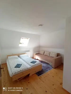 a living room with two beds and a couch at Druga priča in Vlasic
