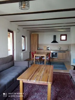 a living room with a couch and a table at Druga priča in Vlasic