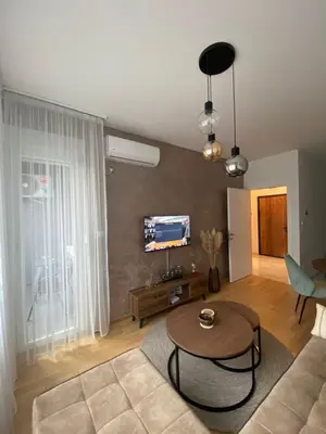 a living room with a couch and a table at Mona in Banja Luka