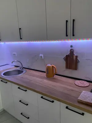 a kitchen with a sink and a counter top with a sink at Mona in Banja Luka