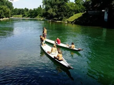 a group of people in boats on a river at Apartman MRL Cavic in Banja Luka