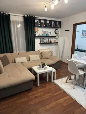 a living room with a couch and a table at Apartman Alchemist I in Bosanska Dubica