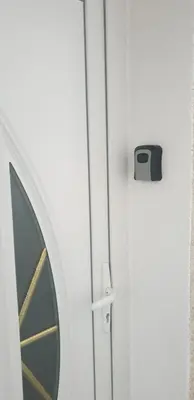 a door with a window with a toaster on it at Apartman Alchemist I in Bosanska Dubica