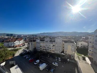 a view of a city with cars parked in a parking lot at Apartman Vista Banja Luka in Banja Luka