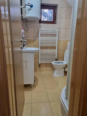 a bathroom with a sink and a toilet at Vikendica Mila in Kupres
