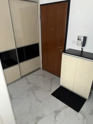 a room with a door and a marble floor at MARICELO in Banja Luka