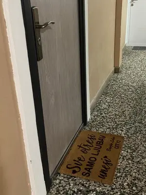 a welcome mat for a door with a sign on it at Banja Luka CITY2 in Banja Luka