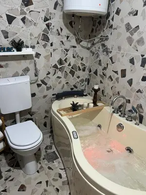 a bathroom with a tub and a toilet and a sink at Banja Luka CITY2 in Banja Luka