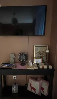a shelf with glasses and other items on it at Banja Luka CITY2 in Banja Luka