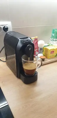 a coffee maker sitting on a counter with a cup of coffee at R-RESIDENCY Panorama in Banja Luka