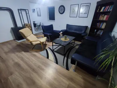 a living room with chairs and a couch and a table at Apartman Čolić - Kupres in Kupres