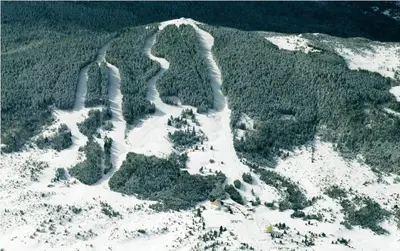 an aerial view of a mountain with snow and trees at Apartman Svalina in Kupres