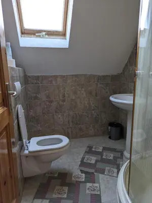 a bathroom with a toilet and a sink at Vila Ružica in Kupres