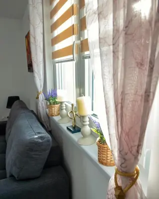a living room with a couch and a window at Vikendica Jadranka in Kupres