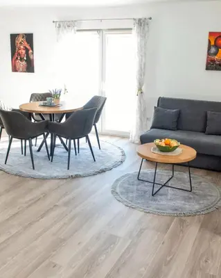 a living room with a couch and a table at Vikendica Jadranka in Kupres