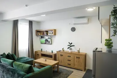 a living room with a couch and a table at S Apart Rooms in Bosanska Gradiška