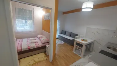 a small room with a small bed and a window at Apartman Solunska 18 Banja Luka in Banja Luka