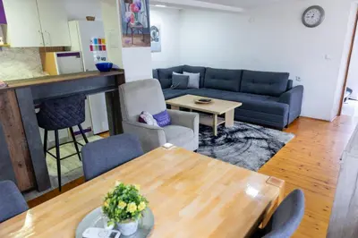 a living room with a couch and a table at Guest House Lejla in Travnik