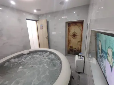 a bathroom with a tub with water in it at Guest House Lejla in Travnik
