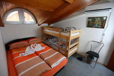 a bedroom with a bed and a bunk bed at Hostel Cuba in Banja Luka