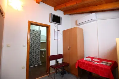 a room with a table with a red table cloth at Hostel Cuba in Banja Luka
