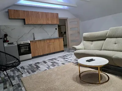 a living room with a couch and a table at Apartman Mihaela in Laktaši
