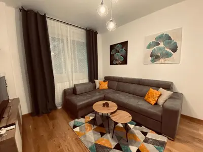a living room with a couch and a table at Apartman Stojić in Banja Luka