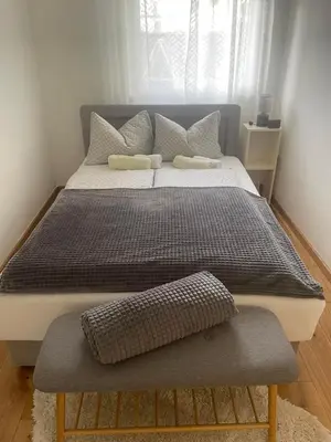 a large bed with two pillows in a bedroom at Apartman Stojić in Banja Luka