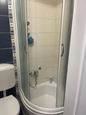 a shower in a bathroom with a toilet at Apartman IN in Banja Luka