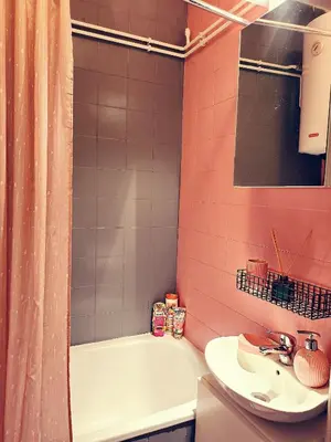 a bathroom with a sink and a tub and a toilet at Apartman TaMaRa in Doboj