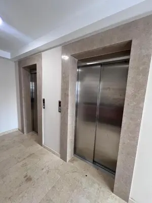 a hallway with two elevator doors in a building at Romanijska in Banja Luka