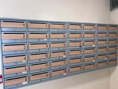 a closet with wooden lockers on a wall at Romanijska in Banja Luka