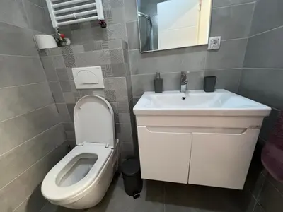 a bathroom with a toilet and a sink at Romanijska in Banja Luka
