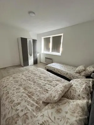 a bedroom with two beds and a window at Rosa Canina Kupres 2 - Centar in Kupres
