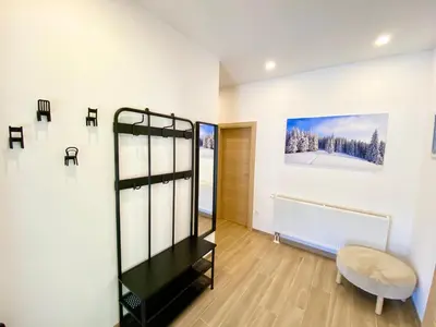 a room with a black shelf and a white wall at Visoravan 1200 in Kupres