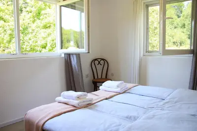 a bedroom with a bed with towels on it at Apartment Pirol: Dorf Hideaway Gornja Breza in Breza