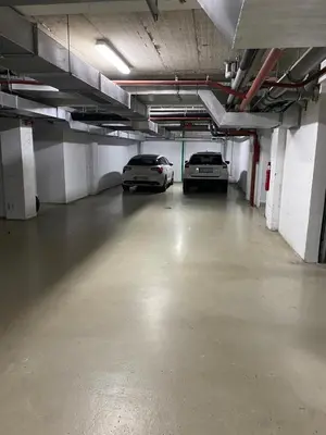two cars parked in an empty parking garage at Kastel in Banja Luka