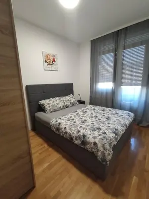 a bedroom with a bed in a room at Kastel in Banja Luka
