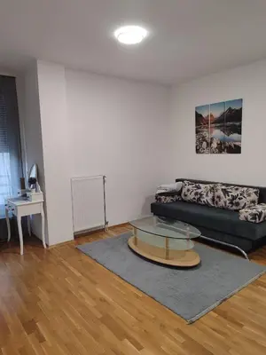 a living room with a couch and a glass table at Kastel in Banja Luka