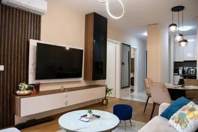 a living room with a large flat screen tv at Harmony Space Apartment in Banja Luka