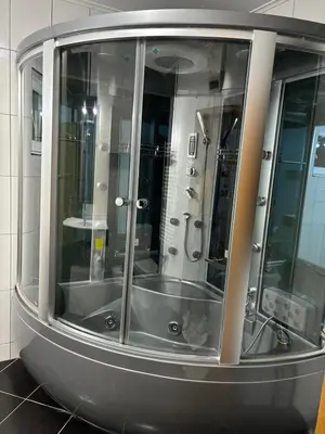 a large glass shower in a bathroom with at VILLA M Rustic & Spa in Slatina Varoš