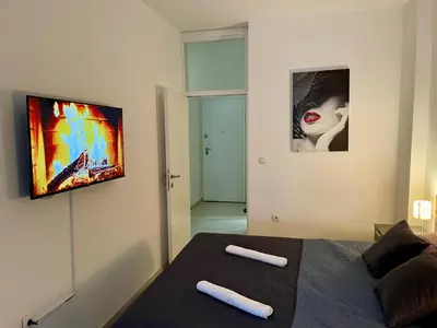 a bedroom with a bed with two white pillows on it at Stan Na Dan - Bewo River Apartments Banja Luka in Rebrovac