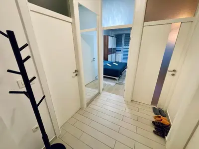 a hallway with a view of a room at Stan Na Dan - Bewo River Apartments Banja Luka in Rebrovac