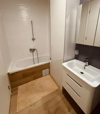 a bathroom with a sink and a bath tub and a sink at Parkpoint in Banja Luka
