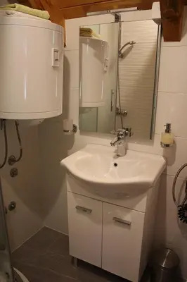 a bathroom with a sink and a shower at LAna in Šipovo