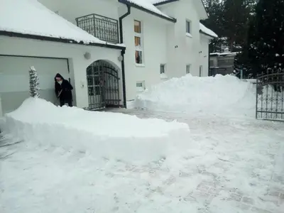 a person standing in front of a pile of snow at Apartman SM IK 1 in Tomislavgrad