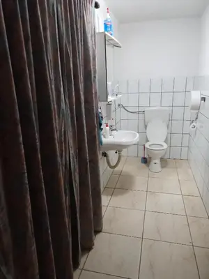 a bathroom with a toilet and a sink at Apartman SM IK 1 in Tomislavgrad