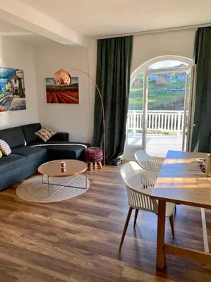a living room with a couch and a table at Sokograd Loft in Šipovo