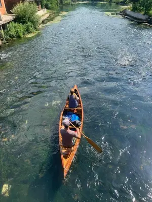 two people in a canoe on a river at Sokograd Loft in Šipovo
