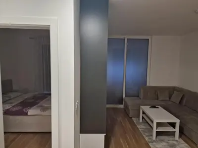 a living room with a couch and a bed at Apartment 4th. Floor II in Banja Luka